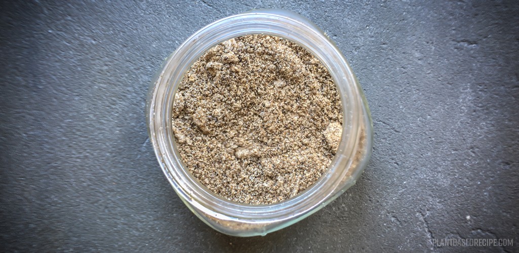 Ground up chia seeds in a glass jar.