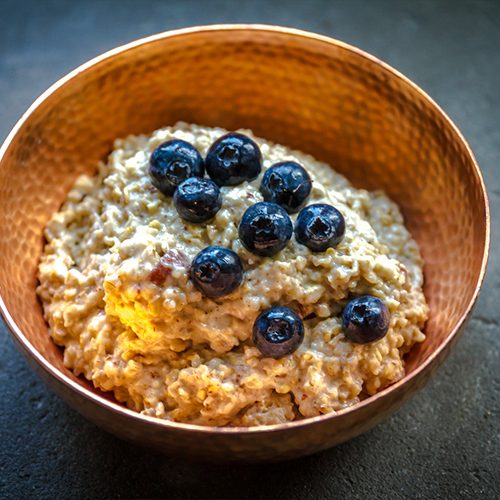 Flavored oatmeal topped with berries.