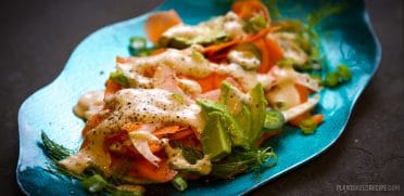 Carrots, avocado and fennel drizzled with a tahini sauce