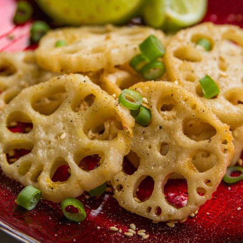 baked lotus root - sesame ginger - on a plate