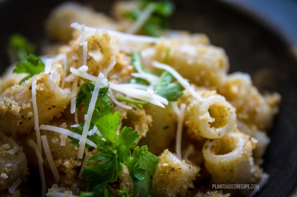 Close up of garlic bread pasta dish.