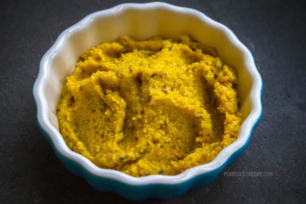 Golden beet spread in a dish.