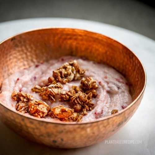 Creamy vegan hot cereal breakfast with raspberries