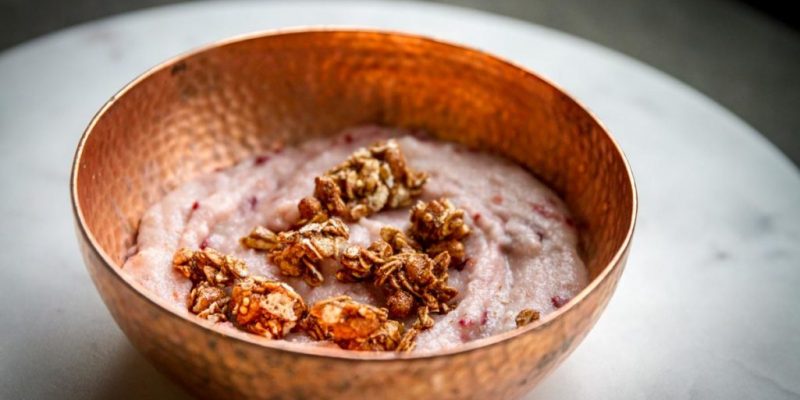 Creamy vegan hot cereal breakfast with raspberries