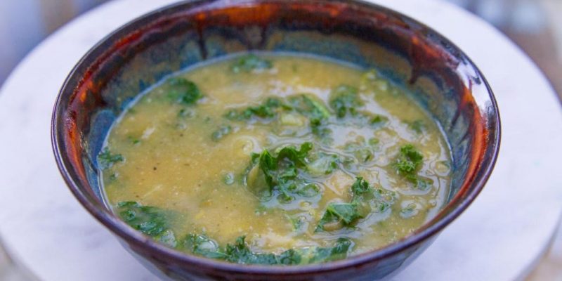 Kale, leeks and potato soup in a bowl