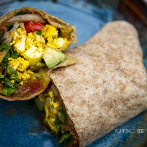 Vegan breakfast burrito on a plate.