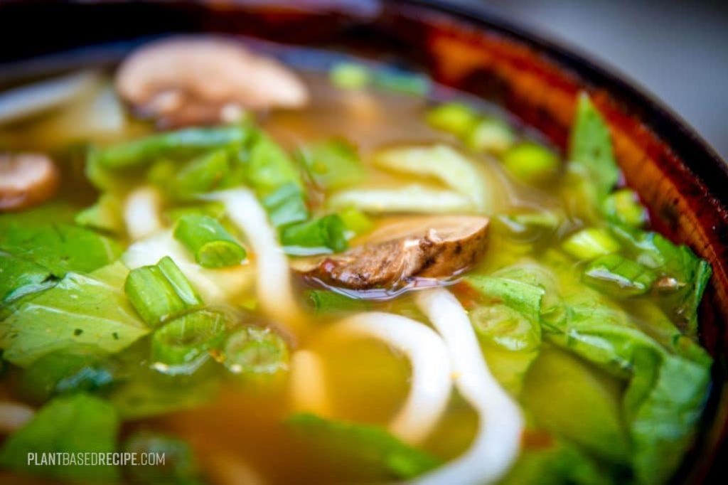 Noodles and vegetables in a flavorful broth.