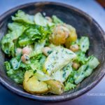 Potato, cucumber, and chickpea salad with creamy dressing.