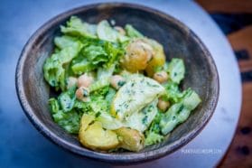 Potato, cucumber, and chickpea salad with creamy dressing.