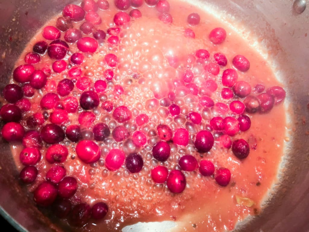 The stir fry sauce starts to thicken, thanks to the cranberries