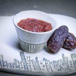 Date paste in a small bowl with dates next to it