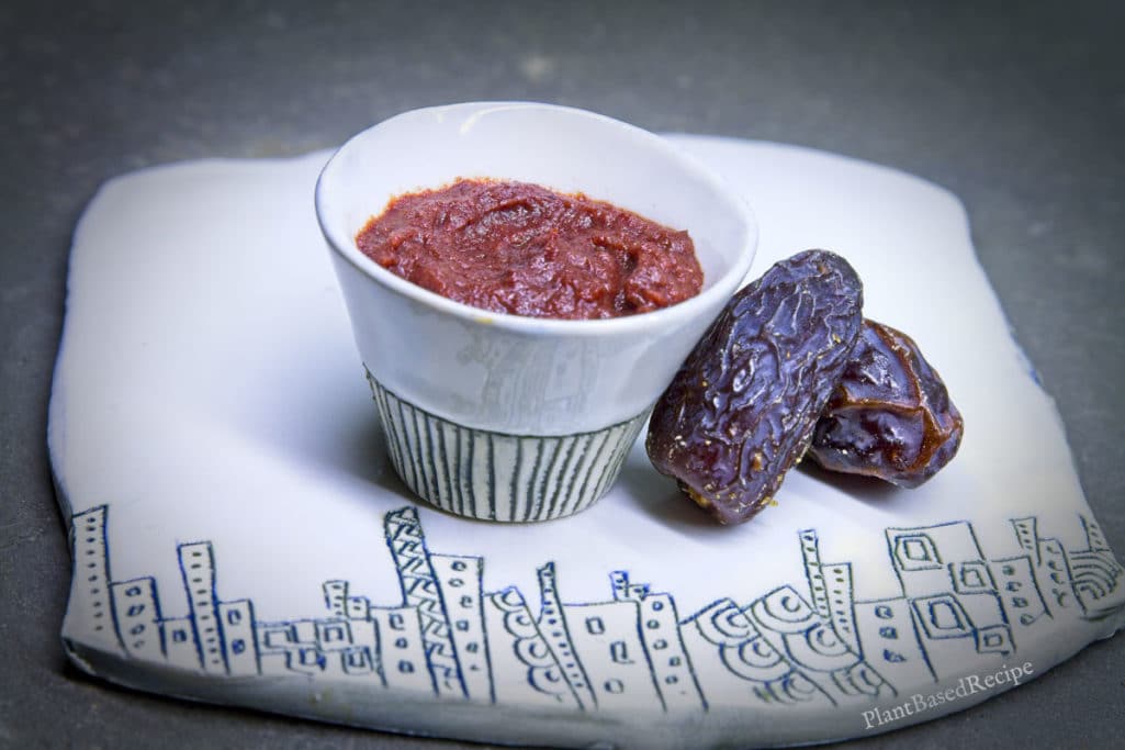 Date paste in a small bowl with dates next to it