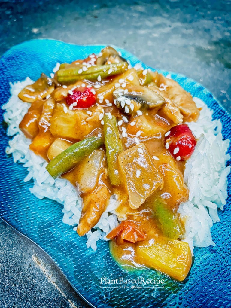 Sweet and sour vegan stir fry served on top of rice.