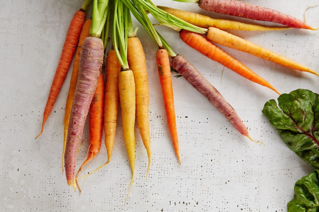 Carrots on a table - plant-based foods make up a plant-based diet.