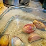 Garlic in hot water in a bowl