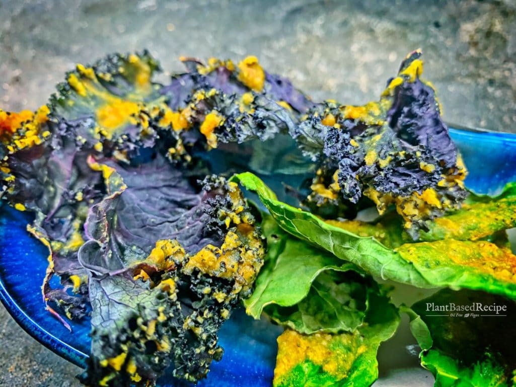 Bright yellow turmeric adds a subtle flavor hint to these cheezy baked kale chips. 