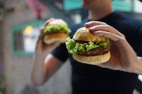 vegan burger being held