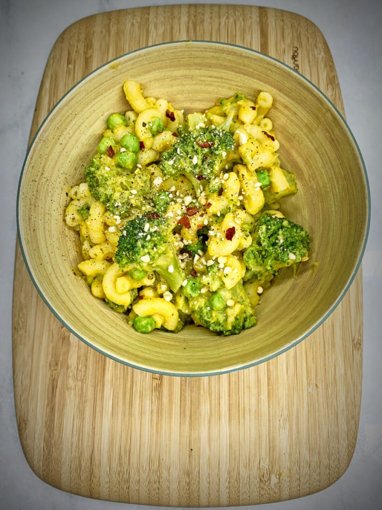 Creamy Hummus Mac and Cheese with broccoli and peas